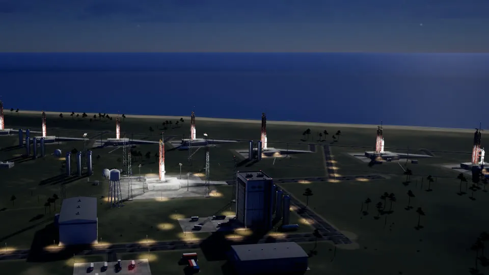 The launch site at night, pads lit by floodlights.