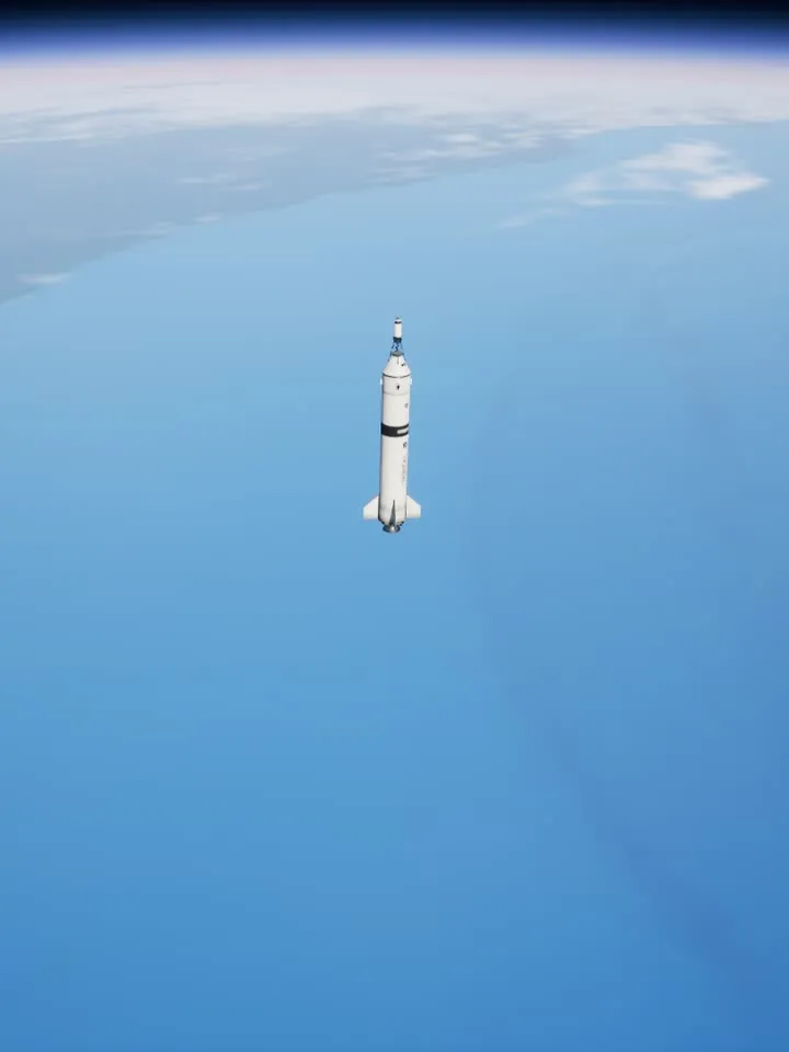 Pathfinder coasting above the ocean with the curve of the Earth at the top of the frame.